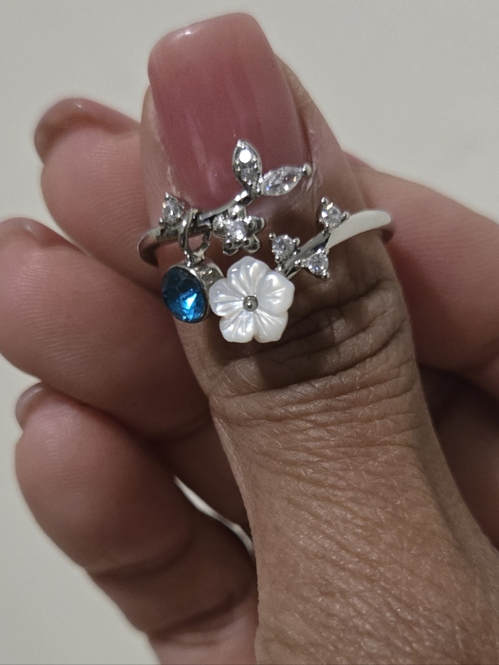 Silver Floral Birthstone Ring with Blue Topez and White Flower - Picture 2 of 6
